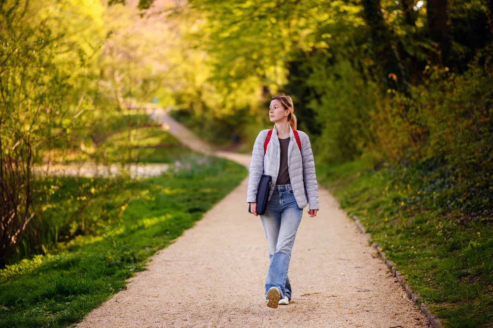 young blonde girl in spring outfit walks in green 2023 11 27 05 13 14 utc